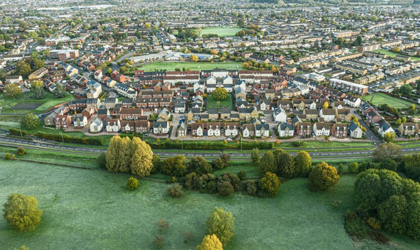 Aerial view of residential neighborhoods and green countryside in Swindon, Wiltshire