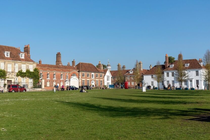 Historic town square with traditional architecture and open green space in Wiltshire